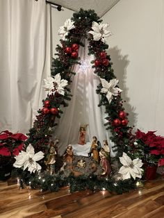 a christmas display with poinsettis and decorations