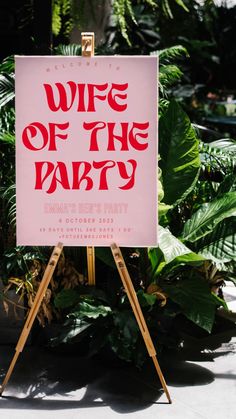 a pink sign that says wife of the party