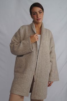 Wrap yourself in the warmth, comfort, and style of the Belen Alpaca Long Cardigan, a versatile knitwear piece designed to keep you warm and stylish throughout the seasons. Crafted from a luxurious alpaca blend, this cardigan/coat is elegant and sophisticated, making it perfect for both casual and dressier occasions. - Luxurious Alpaca Blend.- Fashionable and elegant design.- Practical pockets.- Versatile length that flatters all body types.- Vibrant and natural color options to suit your persona