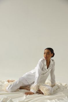 New collection of our pure silk pajamas! Absolutely unique and chic handmade pajama set made of pure silk with amazing feather trim on the sleeves. This pajama set is both lightweight and breathable, so you'll always look and feel great wearing our silky and cozy women's PJs. Silk's natural properties make this an excellent pajama set to wear all year around. In winter or summer, your silk PJs will regulate your body's temperature and keep you comfortable all night long. This pajama set is made White Satin Loungewear Sets, Fitted Silk Sleepwear With Long Sleeves, Fitted Silk Long Sleeve Sleepwear, White Silk Sleepwear For Bedtime, Silk Long Sleeve Sleepwear For Wedding Night, White Silk Long-sleeve Sleepwear, White Silk Long Sleeve Sleepwear, Silk Sleepwear For Pajama Party, Long Sleeve Silk Wedding Sleepwear