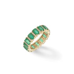 an emerald and diamond band ring