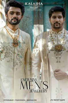 two men in white outfits standing next to each other with necklaces on their necks