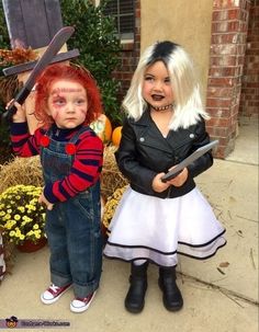 two children dressed up in costumes for halloween