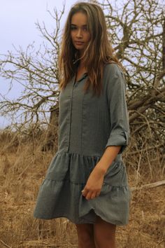 Beautiful model wearing a blue button front babydoll mini dress with long sleeves and a collared V-neckline Babydoll Mini Dress, Rolled Sleeves, Fashion Catalogue, A Button, Boho Blouses, Bohemian Chic, Tiered Skirt, Carry On, Baby Dolls