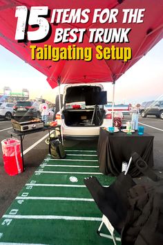 the back end of a van parked on top of a football field with an open trunk