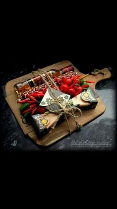 a cutting board topped with lots of different types of food on top of a table