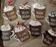 coffee mugs with warm wishes, warm wishes and warm wishes hanging from the handles