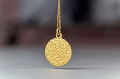 Solid gold phaistos disc necklace, ancient Greek necklace. This pendant was inspired by the ancient Greek Phaistos disc. The pendant is available in 14k yellow, white or 18k rose gold. You can purchase the charm with a 9k solid gold chain, a 14k solid gold chain or as a pendant only without chain. The pendant measures 1.7cm/0.7 inches. You can choose between a brushed/matte or shiny finish. Perfect gift for Valentine, Mother's Day or any other special occasion. Comes in a cute jewelry box. The P Amulet Style Yellow Gold Sterling Silver Coin Necklace, Amulet Sterling Silver Coin Necklace In Yellow Gold, Engraved 14k Gold Amulet Coin Necklace, Spiritual Sterling Silver Coin Necklace In Yellow Gold, Spiritual Yellow Gold Sterling Silver Coin Necklace, 14k Gold Round Coin Necklace Hallmarked, Hallmarked 14k Gold Round Coin Necklace, Round Amulet Necklace Stamped 14k, 14k Stamped Amulet Necklace