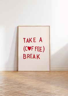 a poster with the words take a coffee break on it in front of a white wall