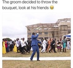 a man in a blue suit is throwing a frisbee at an outdoor event