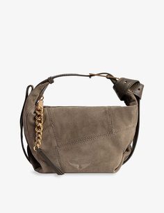 Named after Zadig&Voltaire's creative director of the past 15 years, Cécilia Bönström, the Le Cecilia bag is designed for the modern woman on the go. With practicality at the forefront, the bag is as versatile as can be, easily adjustable with a single movement to a cross-body or shoulder style, worn by the hand or on the arm. The leather bag pays homage to the rock-fuelled aesthetic of the brand, as well as its hometown of Paris with its croissant shape. (Height 20cm, width 36cm, depth 16cm)| Z Turkey In A Bag, Sustainable Leather, Leather Patchwork, Patchwork Bags, Zadig And Voltaire, Metal Buckles, Leather Working, Italian Leather, Shoulder Bag Women