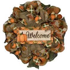 a welcome fall wreath with an orange pumpkin and plaid ribbon hanging on the front door