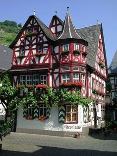 the building has many windows and flowers on it