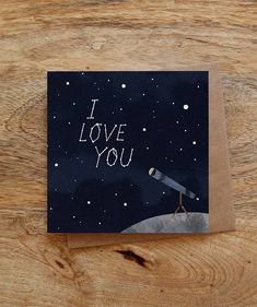 a card with the words i love you written on it and an image of a telescope