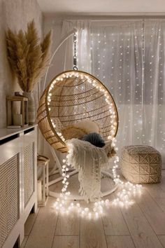 a room with lights and a hanging chair