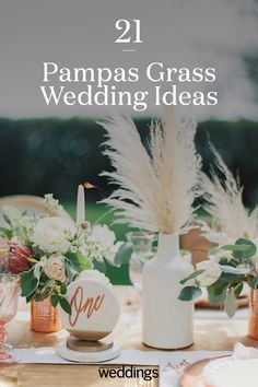 an image of a table setting with flowers and vases on it, including pampas grass