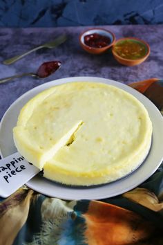 there is a pie on the plate with a piece cut out and ready to be eaten