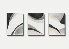 three canvases with black and white designs on them