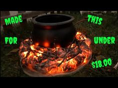 a large pot sitting on top of a fire pit