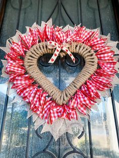 a heart shaped wreath on the front door