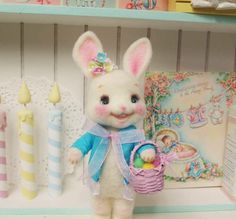 a white stuffed rabbit holding an easter basket