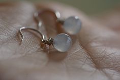 "♡This is a Natural Grade-A Burmese (Myanmar) Glutinous ice(close to ice) white jadeite beads earrings inlaid with 18k platinum. ♡It's a finished product, you can get the style and color from the picture. ♡The bead Size: about 6.6mm. ♡Important to know: have some small white cotton spots. This is the normal appearance of the jadeite. ♡Please note the original colors may be a little bit different from what you see on your monitor. ♡the shop preferential policies: 1. All items are free shipping us Elegant Wedding Earrings With Gemstone Beads, Silver Gemstone Beads Earrings, Silver Round Gemstone Bead Earrings, Silver Gemstone Bead Round Earrings, Elegant White Jade Jewelry, Elegant Agate Gemstone Bead Earrings, Elegant Jade Earrings With Gemstone Beads, White Jade Dangle Jewelry, Elegant White Jade Earrings