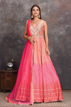 Shop beautiful peach and pink floorlength chanderi Banarasi Anarkali suit online in USA. Set a style statement on special occasions in exquisite designer lehengas, Anarkali suits, sharara suits, salwar suits, Indowestern outfits from Pure Elegance Indian fashion store in USA.-full view Peach Zari Weaving Dupatta For Wedding, Peach Wedding Dupatta With Zari Weaving, Floor-length Peach Dupatta For Reception, Orange Anarkali Gown With Dupatta, Orange Anarkali Set For Reception, Pink Cutdana Sharara Maxi Length, Peach Floor-length Anarkali Set, Pink Cutdana Maxi Length Sharara, Pink Maxi Length Sharara With Cutdana