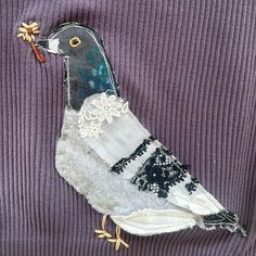 a bird made out of fabric and lace