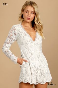 Don't be surprised if spontaneous declarations of love seem to follow the Lulus Express Your Love White Lace Long Sleeve Romper! Romantic white lace and a beige satin lining come together to form a deep V-neckline, a princess-seamed bodice, and long sheer sleeves. Empire waist tops tailored shorts that end with scalloped hems. Hidden back zipper/clasp. Fit: This garment fits true to size. Length: Above mid-thigh. Size medium measures 30" from shoulder to hem. Inseam: 2.00 Front Rise: 17.00 Bust: Great for any cup size. Waist: Fitted - very fitted at natural waist. Hip: Loosely Fitted. Undergarments: May be worn with an adhesive bra, petals, or no bra. Fabric: Fabric has no stretch. Lined. Shell: 100% Polyester. Lining: 100% Polyester. Hand Wash Cold. Do Not Bleach. Line Dry. Iron Low Heat. Feminine White Scalloped Lace, Elegant White Dresses With Lace Closure, Elegant White Lace Dress For Bridal Shower, White Feminine Lace With Patchwork, White Lace Dress With Lace Bodice For Date Night, Chic White Scalloped Lace, Spring Wedding Lace Dress With Lace Closure, Chic Wedding Lace With Lace Trim, Beige Lace Dress With V-neck