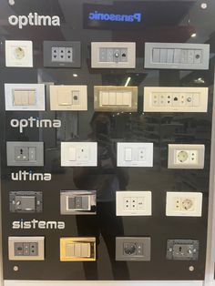 a display case with many different types of electrical switches and sockets on it's sides