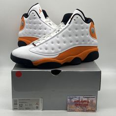 Upgrade your sneaker game with these stylish and comfortable Size 12 Air Jordan 13 Retro sneakers. The eye-catching Starfish White, Orange, and Black colorway is sure to turn heads. Crafted with premium leather and suede materials, these sneakers are built to last and provide maximum comfort during athletic activities. Featuring a round toe design, lace-up closure, and cushioned insole, these sneakers are perfect for men who want to make a statement while staying comfortable. The Air Jordan 13 Retro sneakers are part of the highly sought after Air Jordan product line and are sure to be a valuable addition to your collection. Get your hands on them now! Casual Jordan Lace-up Shoes For Streetwear, Casual Lace-up Jordan Shoes For Streetwear, Casual Jordan Shoes With Boost Midsole For Streetwear, Casual High-top Synthetic Jordan Shoes, Casual Jordan Shoes With Cushioned Footbed For Streetwear, Jordan Leather Shoes With Rubber Sole And Round Toe, Leather Jordan Shoes With Rubber Sole And Round Toe, Leather Jordan Shoes With Rubber Sole, Casual Jordan Shoes With White Sole For Streetwear