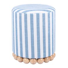 a blue and white striped stool with wooden beads