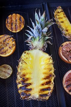 pineapple, oranges and grapefruit on the grill