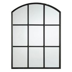 an arched window with multiple panes on each side and white glass in the middle