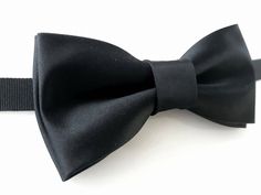 "E.Lash - Lithuanian designer specializing in handmade bow ties, pocket squares, cufflinks, earrings and other accessories since 2013. * Bow tie material: silk; * Bow tie adjustable black velvet strap; * Handmade; * Brand new; * Type: pre-tied; * Accessories are packaged in stylish gift box; * E.Lash accepts custom and wholesale orders also (please contact E.Lash). * Could match pocket square also. Pocket square from over 500+ various colors and materials is available (please contact E.Lash orde Black Bow Tie With Butterfly Knot For Business, Black Butterfly Knot Bow Tie For Business, Black Butterfly Knot Bow Tie, Dapper Butterfly Knot Bow Tie For Black-tie Events, Classic Black Bow With Butterfly Knot, Classic Black Butterfly Knot Bow, Elegant Black Ties With Butterfly Knot, Elegant Black Tie With Butterfly Knot, Black Bow Tie Back Ties For Wedding