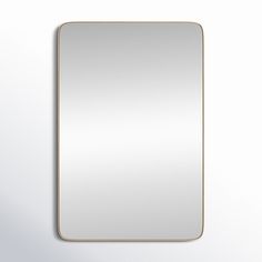 an empty square mirror hanging on the wall