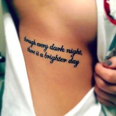 a woman with a tattoo on her stomach that says, always every dark night there is a brighter day