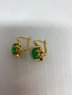 Vintage nephrite Jade golden bronze earrings These earrings are about a half an inch long All jewelry is shipped free in the US in a nice gift box. Check out our over a THOUSAND great reviews Jade Earrings Vintage, Classic Green Clip-on Earrings, Green Formal Earrings With Ear Wire, Classic Green Earrings With Ear Wire, Vintage Jade Round Earrings, Gold Jade Earrings With Ear Wire, Formal Green Nickel-free Earrings, Classic Jade Earrings Gift, Classic Jade Earrings As Gift