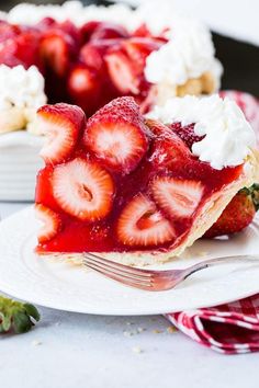 a slice of strawberry pie on a plate with a fork