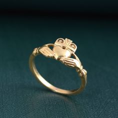 Dainty Claddagh Celtic Irish Ring, Claddagh ring, Claddagh Ring heart hand ring, Gift for her, promise ring, Friendship Ring, love ring, gift Metal:- Brass ✦ Our rings are made of high-quality Brass metal and are carefully crafted by hand in our family workshop. The brass metal will develop a nice antique color over time. So, I suggest cleaning it once in a while for getting back to the shiny original color. You can use natural ingredients like lemon or vinegar with water to clean it. Also, appl Symbolic Wedding Rings For Valentine's Day, Symbolic Promise Jewelry For Valentine's Day, Symbolic Jewelry For Promise On Valentine's Day, Symbolic Heart Shaped Rings As Gifts, Symbolic Heart Shaped Wedding Rings, Symbolic Heart-shaped Wedding Ring, Symbolic Valentine's Day Jewelry Ring, Symbolic Ring Jewelry For Valentine's Day, Symbolic Heart Ring For Valentine's Day Gift