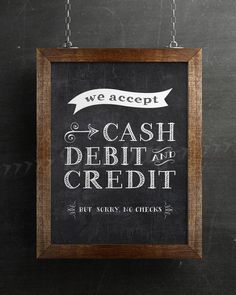 we accept cash, debt and credit but sorry no checks sign hanging on the wall