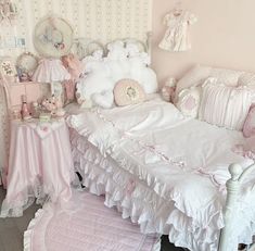 a baby's room with pink and white decor