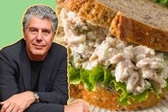 a man sitting in front of a large sandwich with chicken salad on it's side