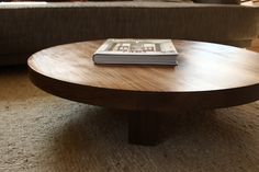 a coffee table with a book on top