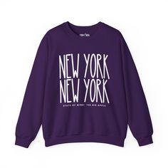 Elevate your urban style with our "New York New York Chic" Women's Sweatshirt, designed for those who appreciate the dynamic energy of the city that never sleeps. Embrace the essence of New York's iconic fashion scene while enjoying unparalleled cozy comfort. Crafted from premium materials, this sweatshirt is more than just a garment; it's a statement piece. The intricate design seamlessly integrates the bold "New York New York" lettering, showcasing your love for the city's vibrant spirit. The Urban Purple Letter Print Top, Trendy Purple Sweatshirt With Graphic Print, Trendy Purple Sweater For Streetwear, Winter Slogan Tops For Streetwear, Urban Winter Tops With Slogan, Urban Winter Tops With Text Print, Winter Athleisure Top With Text Print, Athleisure Winter Top With Text Print, Winter Streetwear Sweater With Lettering