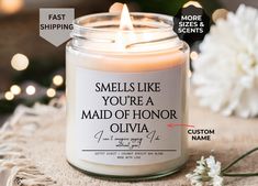 a candle with the words smell like you're a maid of honor written on it