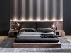 a bed with black sheets and pillows in a room that has vertical blinds on the wall