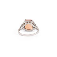 The Story Beautiful in color and style, this vintage ring will stop you in your tracks. Done in platinum, it centers around a gorgeous Imperial Topaz weighing approximately 4.80 carats. The stone sits in a four-prong setting with six single cut diamonds, each weighing approximately 0.03 carats, tapering down the sides. The unique stone has the most beautiful hue. In the orange-pink family, it looks like a sunset. Measuring 0.4 inches tall it looks amazing on the finger. A ring like this is a jewelry staple you'll wear for years to come. The Specs Style Number: R2542 Vintage, circa late 20th century Platinum Imperial Topaz, 4.80 carats, 10.4 x 9.1 mm (approx.) 12 single cut diamonds, each 0.03 carats (approx.) Total diamond weight approximately 0.32 carats Height of front face of ring 0.40" Classic Topaz Rings With Center Stone, Classic Rings With Center Stone In Topaz, Timeless Polished Topaz Ring, Classic White Gold Topaz Ring, Timeless Topaz Anniversary Ring, Formal Emerald Cut Multi-stone Topaz Ring, Formal Multi-stone Topaz Ring In White Gold, Timeless Topaz Ring With Center Stone For Formal Occasions, Timeless Formal Topaz Ring With Center Stone