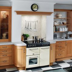 a kitchen with an oven, stove and counter top in it's center area