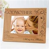 a wooden frame with an image of a mother and baby